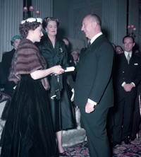 Princess Margaret presents Christian Dior with a s