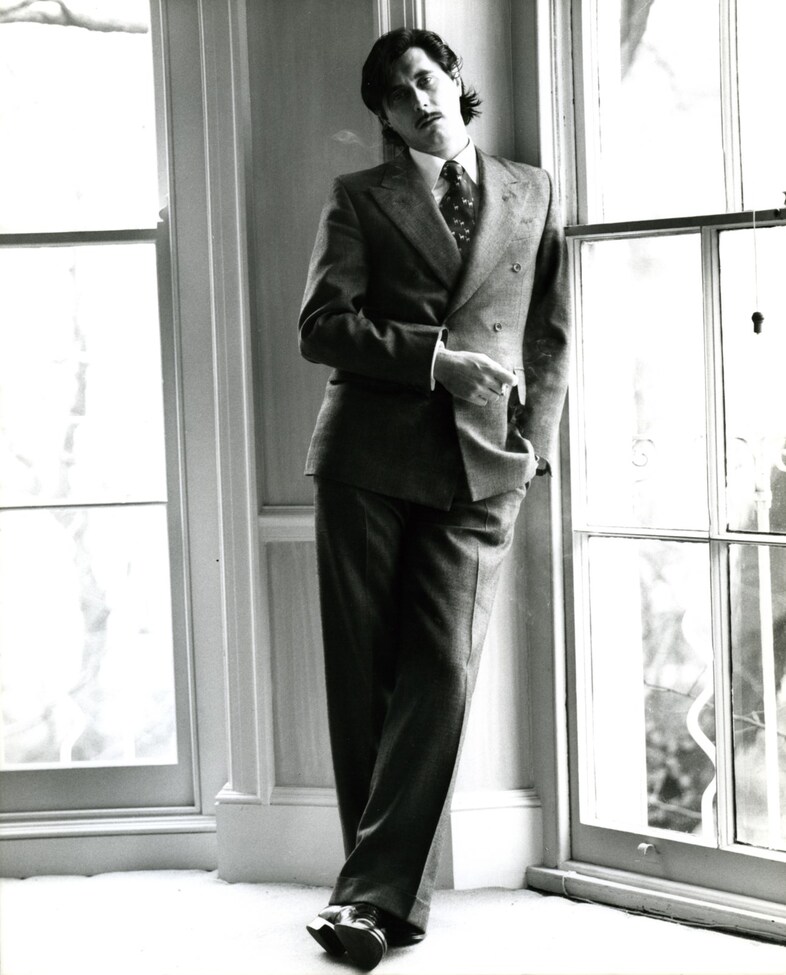 BF with moustache standing by window; 1976 [1]